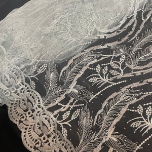White embroided  studded scalloped tulle net bridal fabric..52” wide
