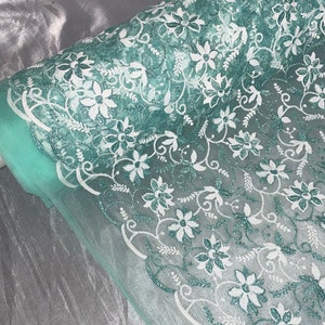 Mint green floral embroided scalloped tulle net bridal fabric..54” wide