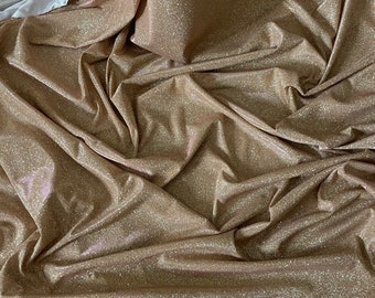 Two tone gold/pink sparkly glitter moonlight stretch dress fabric..58"'wide