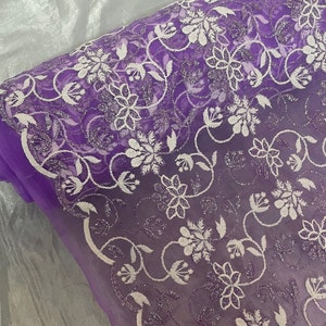 Purple floral embroided scalloped tulle net bridal fabric..54” wide