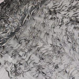 Silver/grey floral embroided pearl scalloped tulle net bridal fabric..52” wide
