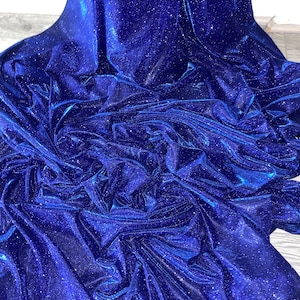 Roysl blue sparkly glitter moonlight stretch dress fabric..58"'wide