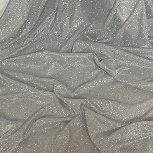 White/silvee sparkly glitter moonlight stretch dress fabric..58&quot;&#39;wide C