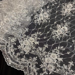 White floral embroided sequin pearl scalloped tulle net bridal fabric..52” wide