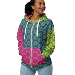 May include: A black zip-up hoodie with a colorful donut pattern. The hoodie has a white zipper and a white drawstring. The pattern is made up of pink, blue, yellow, and green donuts on a black background.
