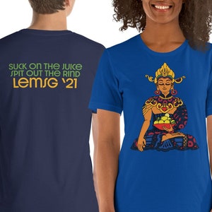 May include: Two t-shirts, one navy blue and one royal blue. The navy blue t-shirt has the text "SUCK ON THE JUICE SPIT OUT THE RIND LEMSG '21" printed on the back. The royal blue t-shirt has a colorful illustration of a person sitting in a meditative pose holding a bowl of fruit.