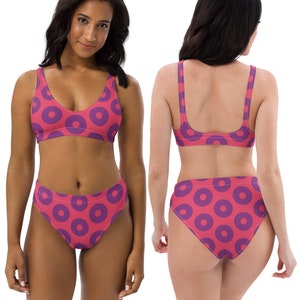 May include: A pink and purple bikini with a donut pattern. The bikini top has a scoop neck and adjustable straps. The bikini bottom has a high-cut leg and a full back.