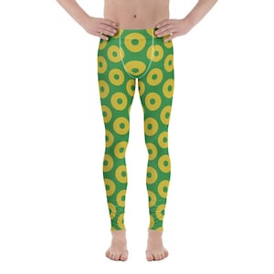 May include: Green leggings with a repeating pattern of yellow circles. The leggings are form-fitting and reach to the ankles. The yellow circles have a textured appearance.
