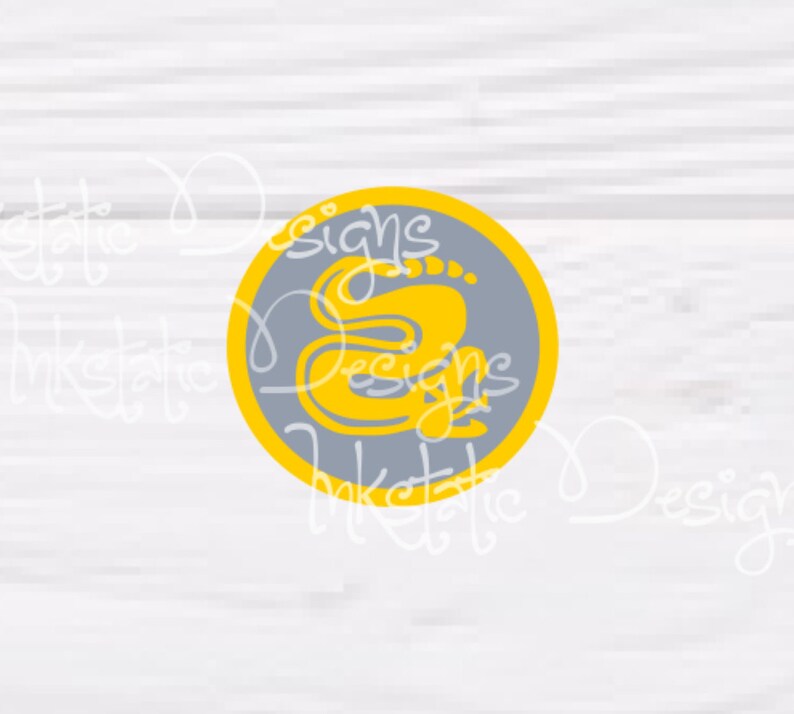 May include: A circular graphic with a gray background and a yellow border. The graphic features the word "Designs" in yellow script, along with the letter "S". The background is a light gray wood grain.