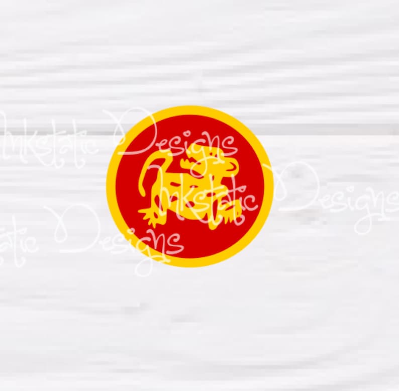 May include: A circular graphic featuring a yellow monkey-like figure inside a red circle with a yellow border. The text "Inkstatic Designs" is visible in a cursive font around the graphic. The design is set against a white wood grain background.