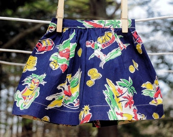 Falda de algodón azul marino con estampado pirata Tiki para niña, años 60, talla 0 a 3 meses o para muñeca.