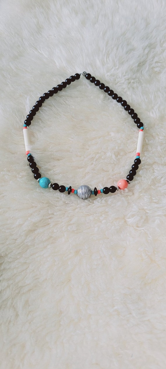 Onyx, coral and turquoise colored beaded necklace.