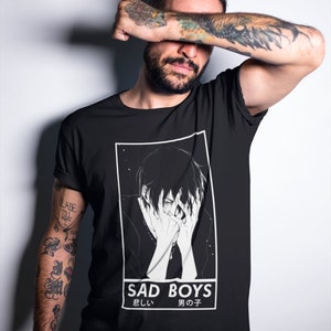 May include: Black t-shirt with a graphic of a sad anime boy with the text "SAD BOYS" and the Japanese text "悲しい 男の子" (meaning "Sad Boy")