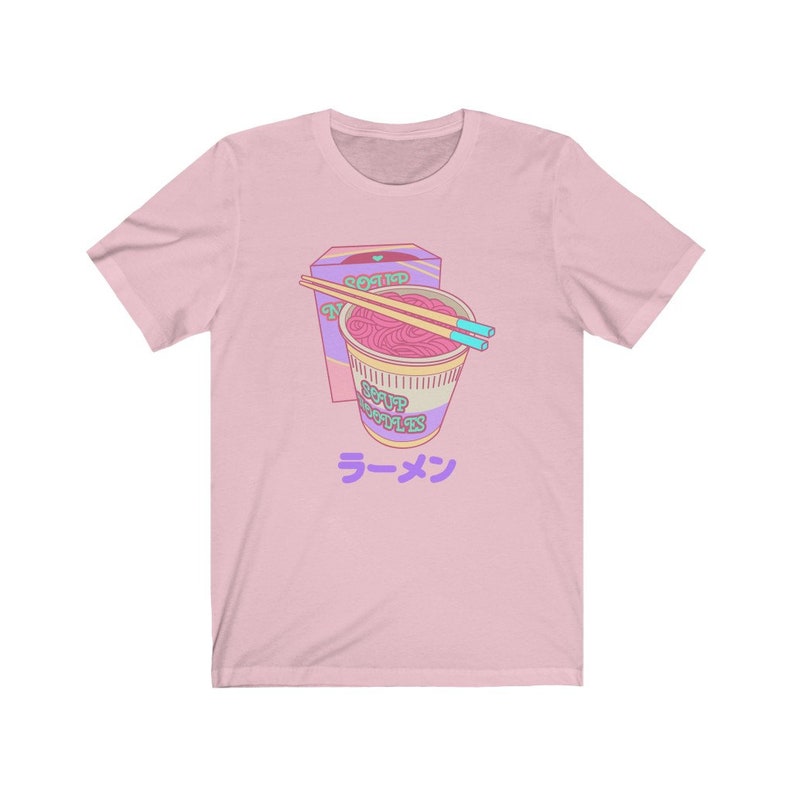May include: Pink t-shirt with a cartoon illustration of a bowl of ramen noodles with chopsticks and a box of noodles that says "Roasted Noodles" and "Soup Noodles". The text "ラーメン" is printed below the bowl of noodles.