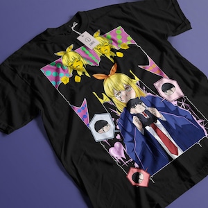 May include: Black t-shirt featuring a colorful anime-style graphic. The design includes multiple anime characters with blonde hair, a blue blazer, and a red tie. The shirt has a tag attached.