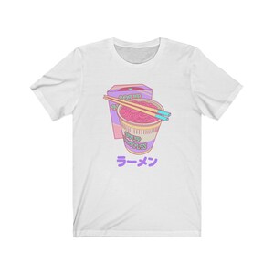 May include: White t-shirt with a cartoon illustration of a bowl of ramen noodles and a box of ramen. The text "Ramen" is written in Japanese characters below the bowl.