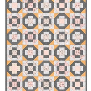 May include: A quilt with a geometric pattern of squares and circles in shades of gray, pink, and yellow.