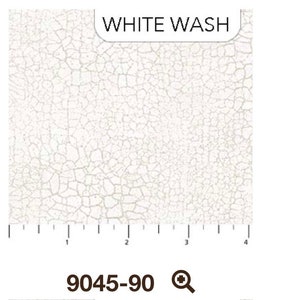 May include: White wash textured fabric with a white crackle finish. The fabric is measured in inches. The fabric is labeled "WHITE WASH" and "9045-90".