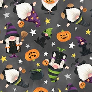 May include: A repeating pattern of Halloween-themed gnomes, pumpkins, stars, and a black cat on a dark gray background. The gnomes wear witch hats and hold pumpkins. The pumpkins have carved faces. The stars and moons are yellow.