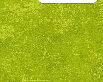 May include: A close-up of a textured fabric in a bright chartreuse green color. The fabric has a slightly distressed look, with a subtle pattern of lines and dots. The fabric is shown against a white background with a ruler for scale.