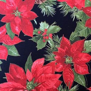 May include: Red poinsettia flowers with green leaves and pine cones on a black background. This fabric features a festive Christmas design.