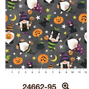 May include: Halloween-themed fabric featuring gnomes, pumpkins, stars, and moons on a dark gray background. The gnomes wear pointed hats and hold brooms. The fabric has a repeating pattern with a ruler along the bottom. The text "24662-95" is also present.