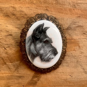 A Vintage Made in Western Germany Schnauzer Dog Brooch Pin- Porcelain? glass? Metal bronze colored rim- Very Unique and RARE Find!