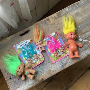 Set of vintage 1990s trolls, earrings, dolls, and keychain- collectors toys
