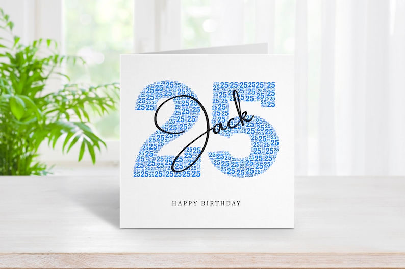 May include: A white card with a blue number 25 made of smaller 25s. The name Jack is written in black cursive over the number. The text "HAPPY BIRTHDAY" is printed below the number.