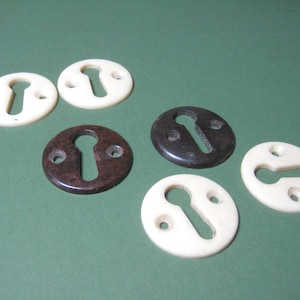 Pairs 1930's escutcheons | 2 colours brown and ivory | Keyhole surrounds | 1930's ironmongery | Vintage ironmongery