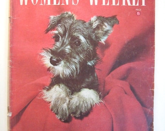 May include: A magazine cover featuring a black and gray schnauzer puppy sitting on a red blanket. The magazine is titled "Women's Weekly" and has the text "Pre-wedding parties: recipes and gift ideas for 18 novel themes... Australia in color: 8 river and sea pictures worth framing... Canned fruit recipe contest..."
