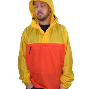 May include: A yellow and orange hooded jacket with a zipper closure and a large pocket on the front.
