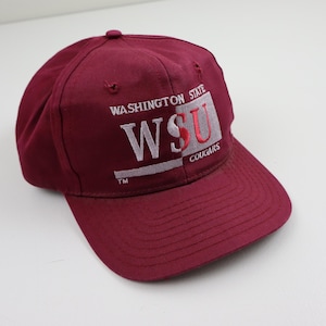 May include: A maroon baseball cap with a white and red embroidered logo that says "Washington State WSU Cougars TM".