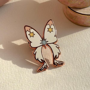 Cartão transparente inspirado: broche de esmalte Flight Bow