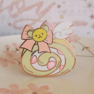 Pin de esmalte con forma de rollo suizo de Kero