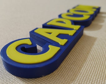 Capcom video game logo sign 8.25in (3D printed, man cave, game room, videogame, decor, gaming, gamer, gift, stocking stuffer)