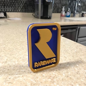 Revised* Rareware Video Game Logo Sign Decoration ~ 4.5x3in (videogame, decor, gaming, retro, gamer, stocking stuffer, game room)