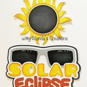 May include: A yellow sun with a black circle in the center, a pair of black sunglasses with a gray frame, and the text "SOLAR ECLIPSE" in yellow and red letters.