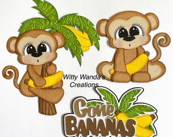May include: Paper cutouts of monkeys holding bananas, with a palm tree and the phrase "Gone Bananas." The monkeys are brown with large eyes and are holding yellow bananas. The palm tree has green leaves and yellow fronds.