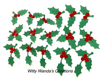 May include: Twenty-two green holly leaf cutouts with red berries. The holly leaves are in various sizes and shapes. The berries are in groups of two or three.