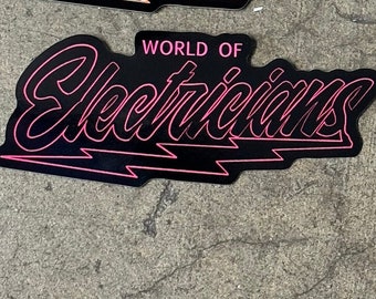 May include: Black and pink sticker with the text "WORLD OF Electricians" in a stylised font with a lightning bolt underneath.