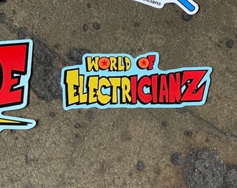 May include: A blue and yellow sticker with the text "WORLD OF ELECTRICIANZ" in red and yellow letters. There are two red stars on the sticker.