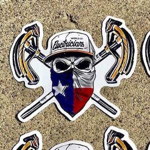 May include: A sticker featuring a skull wearing a baseball cap that says "World of Electricians" and a bandana with the Texas flag. The skull is holding two crossed wrenches.