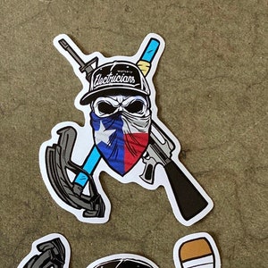 May include: A skull wearing a black baseball cap with the text "World of Electricians" and a bandana with the Texas flag design. The skull is holding a blue cable and a black rifle.