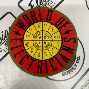 May include: A yellow and red circular sticker with the words "World of Electricians" in black lettering. The sticker has a green border and a smaller circle in the center with electrical formulas and symbols.