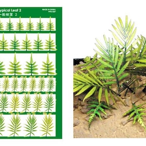 Puede incluir: Una hoja de papel verde con una cuadrícula de 20 formas de hojas verdes y amarillas. El texto "Typical Leaf 2" y "一般樹葉 2" está impreso en la hoja. La hoja es para modelismo.