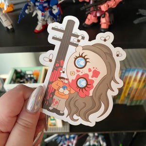Sticker fille tête suspendue en vinyle brillant