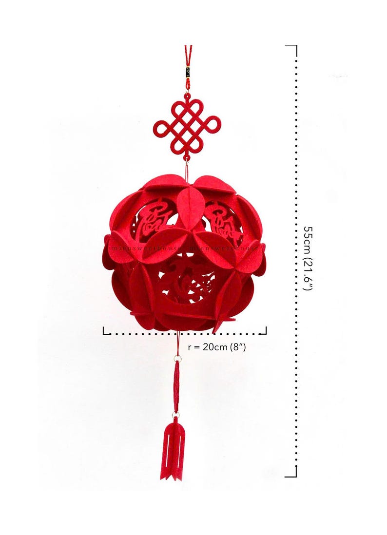May include: Red felt Chinese New Year lantern with a knotted tassel and a red tassel hanging from the bottom. The lantern is 21.6 inches tall and 8 inches in diameter.