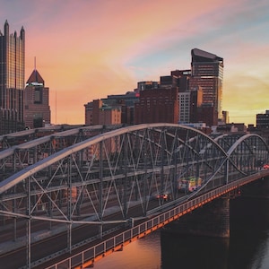 Cotton candy sunrise skies over the Smithfield Street bridge and Pittsburgh skyline