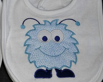Cute monster boy applique machine embroidered infant toddler white bib.